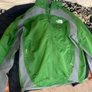 Selling a small The north face windbreaker it is green and grey